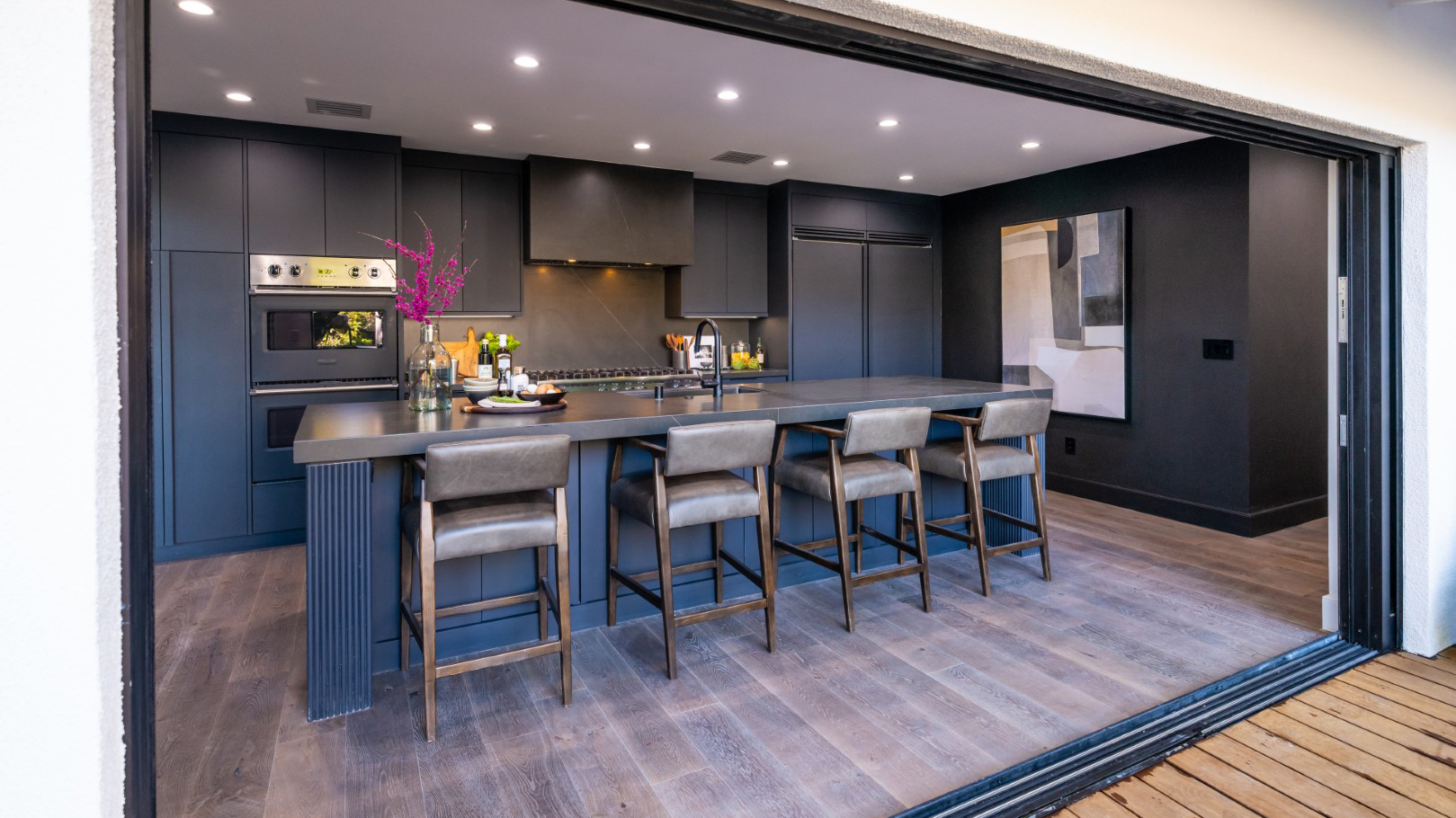 The kitchen of LeAnn Rimes' friend Roger's home after renovations, as seen on Celebrity IOU.