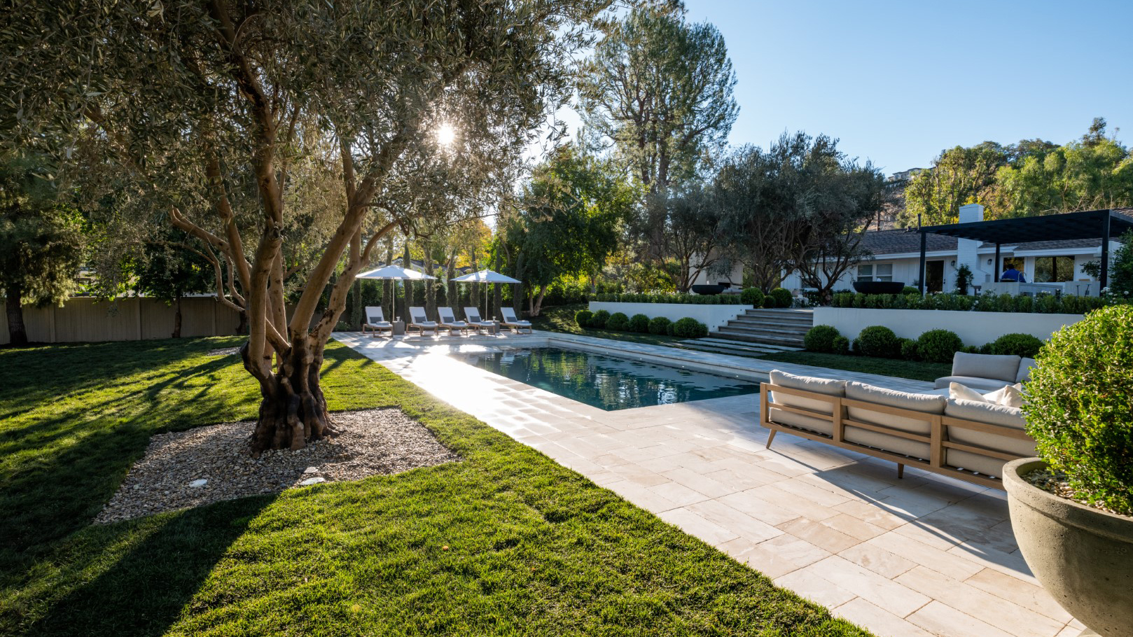 The backyard after renovations by Drew and Jonathan Scott with Kris Jenner and Kim Kardashian, as seen on Celebrity IOU.