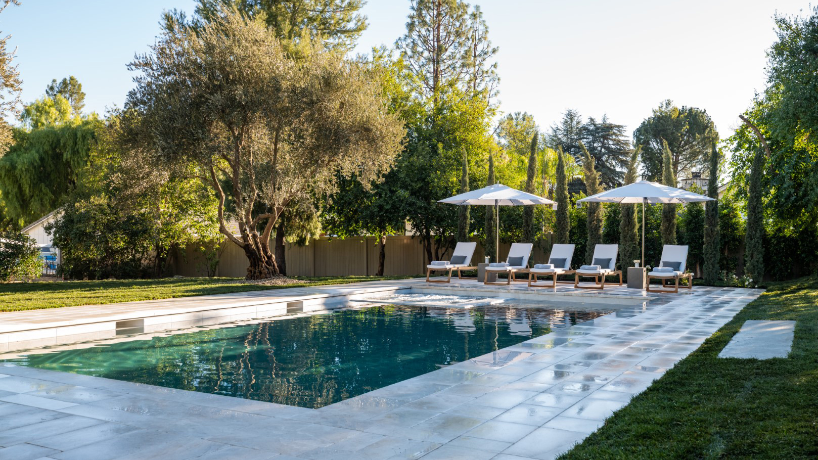 The backyard after renovations by Drew and Jonathan Scott with Kris Jenner and Kim Kardashian, as seen on Celebrity IOU.